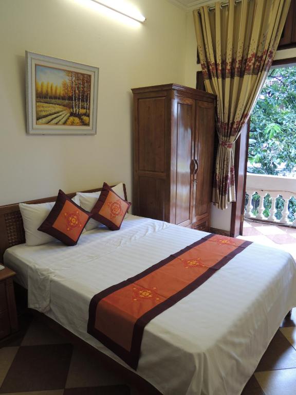 Postel nebo postele na pokoji v ubytování Hanoi Ecogreen Hostel
