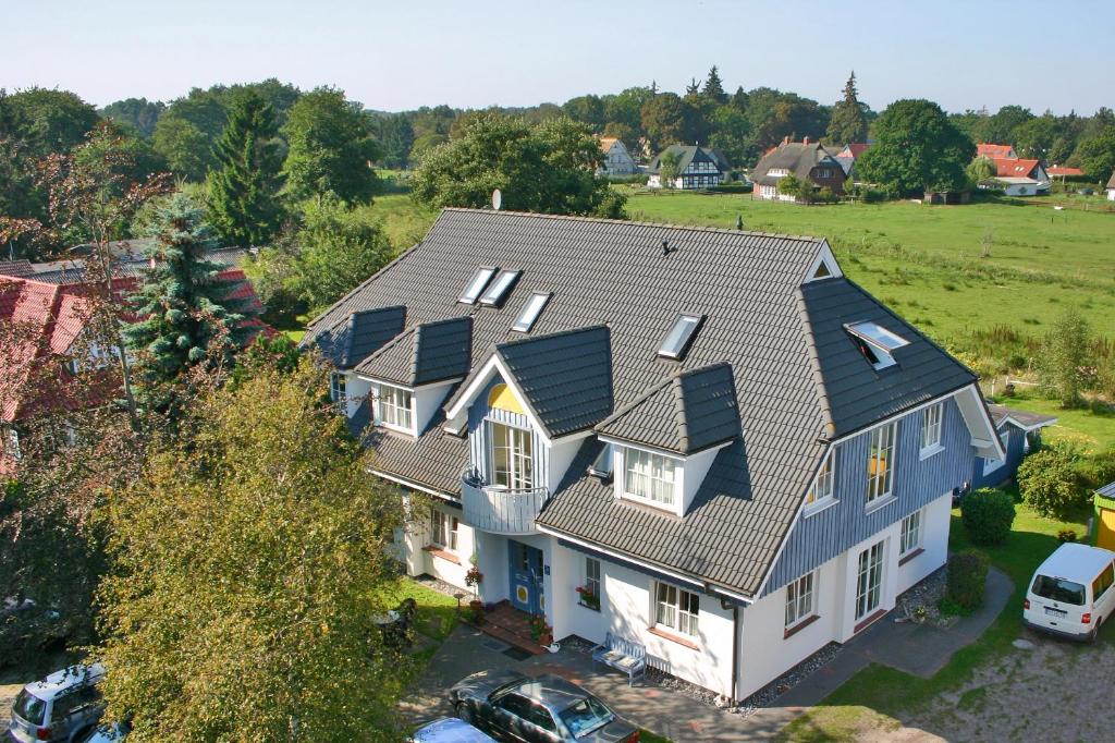 an overhead view of a house with a roof at Pension Grosser in Prerow