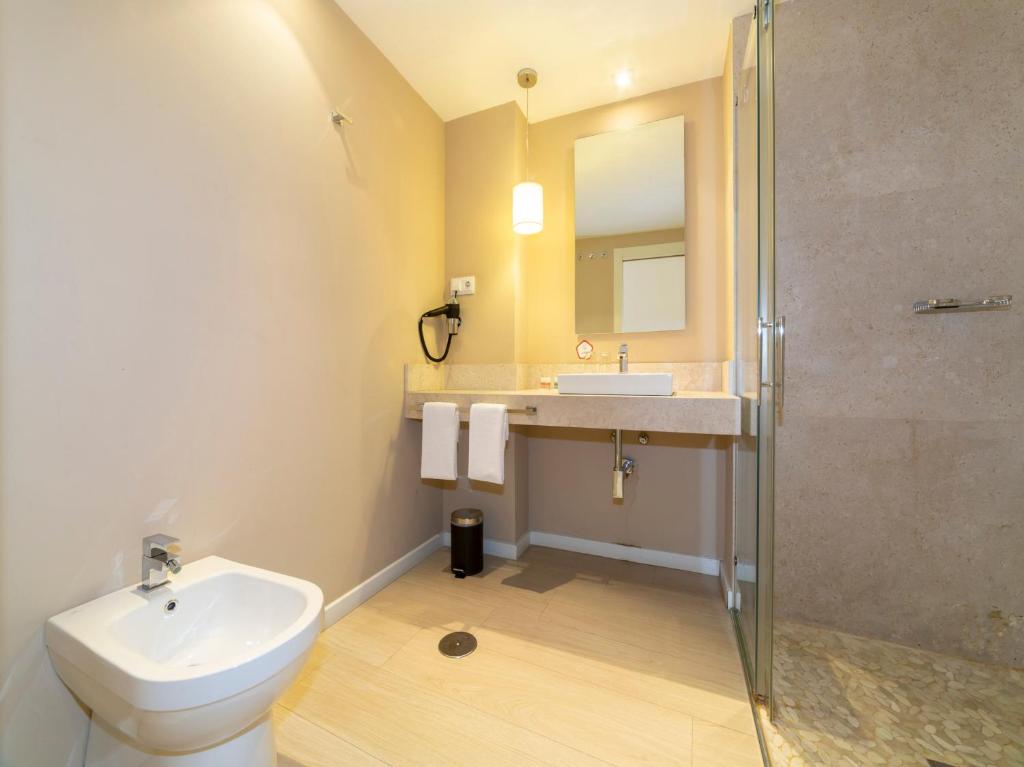 Kúpeľňa v ubytovaní Hotel Altora