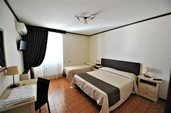 Postel nebo postele na pokoji v ubytování Hotel Il Cammino Di Francesco