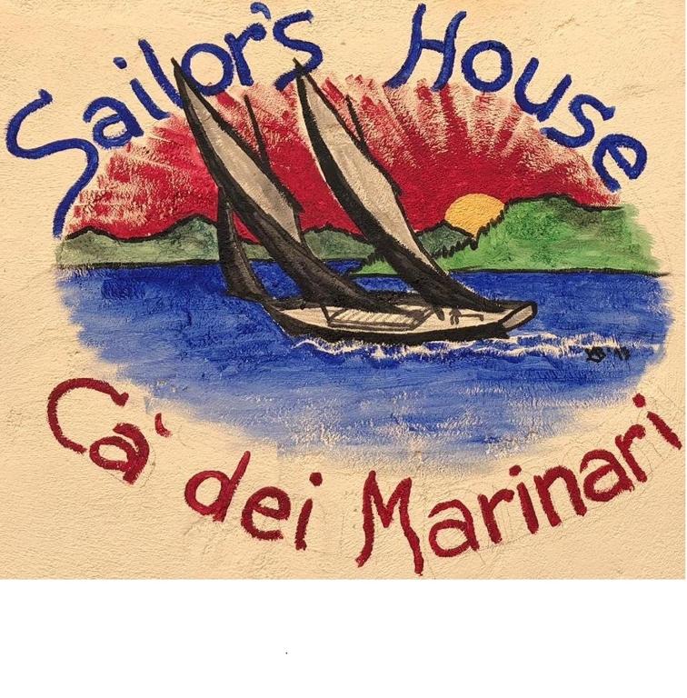 a painting of a boat on the water with the words advisors house of mariner at Garda Sailor’s House in Garda