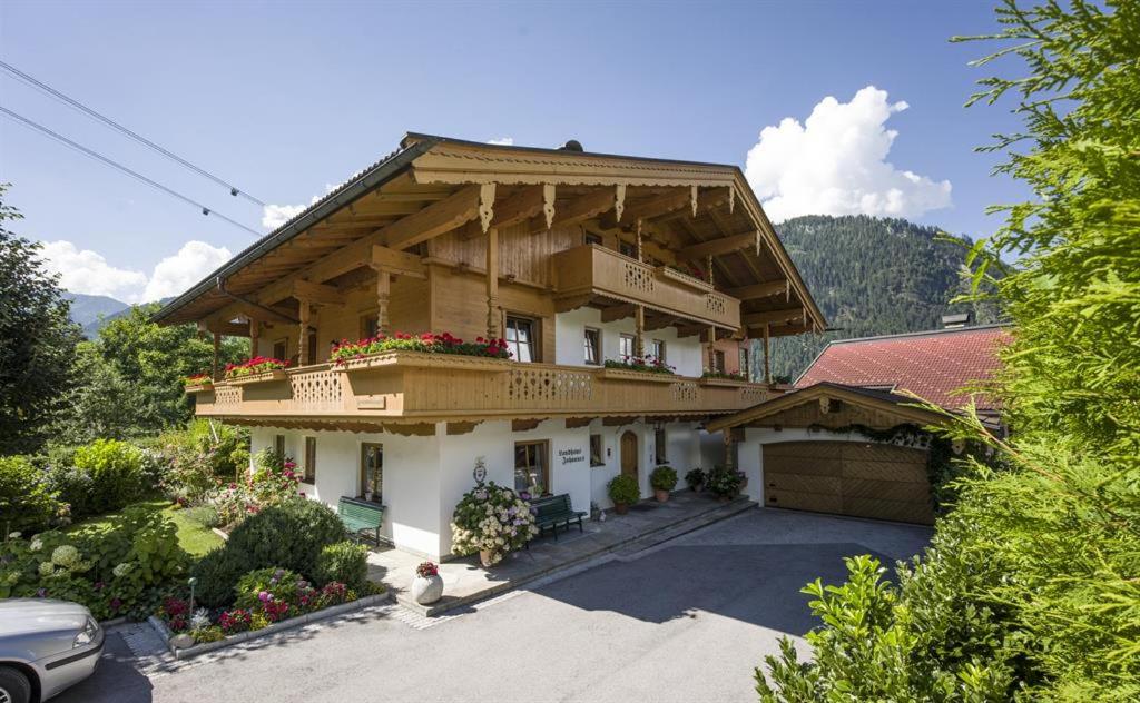 a large house with a balcony on top of it at Landhaus Johannes in Mayrhofen
