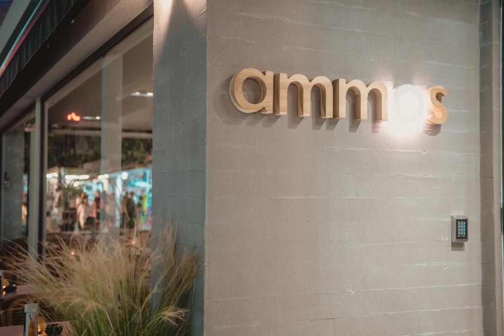 a amazon sign on the side of a store at Ammos Beach Seaside Luxury Suites Hotel in Olympic Beach