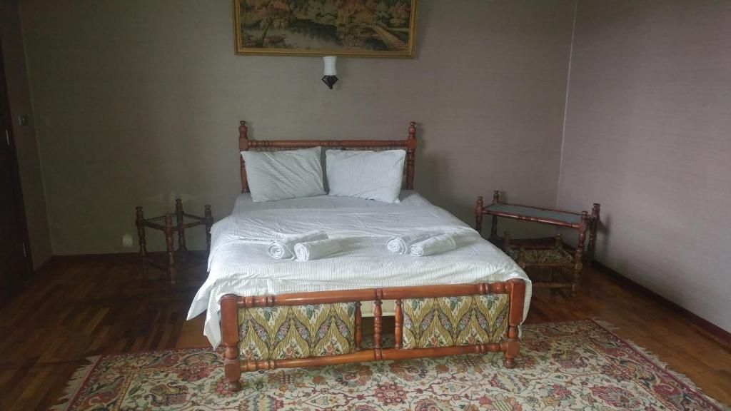 Postel nebo postele na pokoji v ubytování Tirkius House