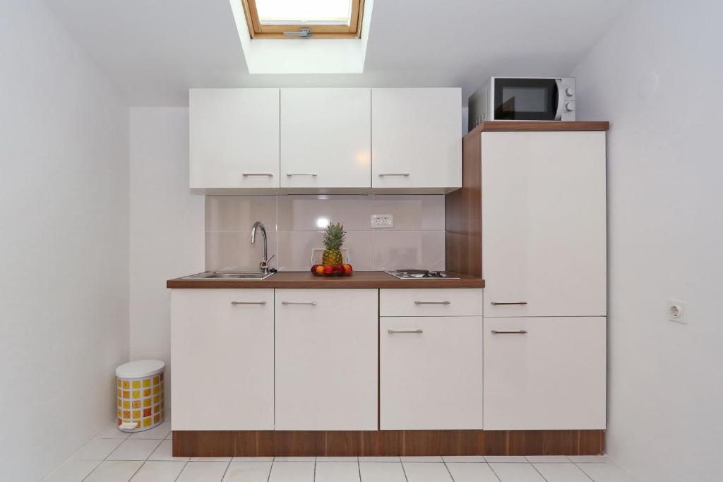 Kuchyň nebo kuchyňský kout v ubytování Apartments Golub