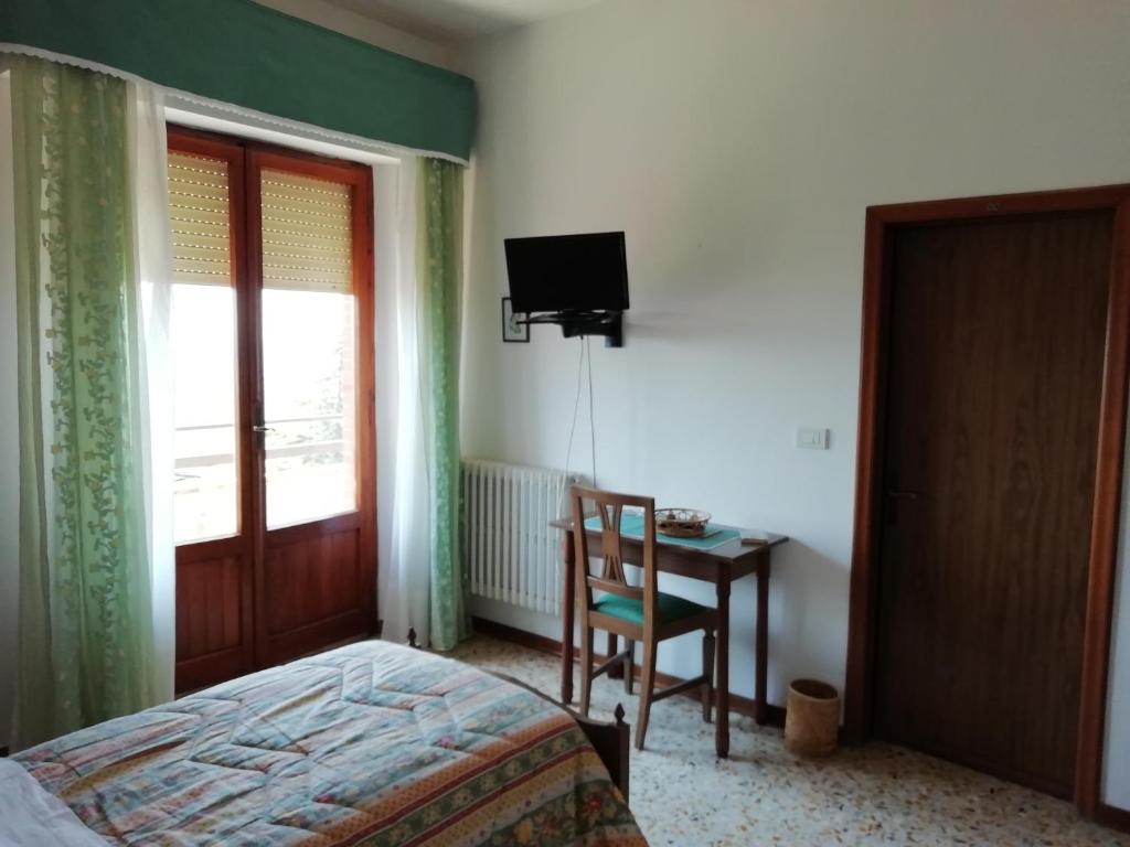 Postel nebo postele na pokoji v ubytování Albergo La Torre