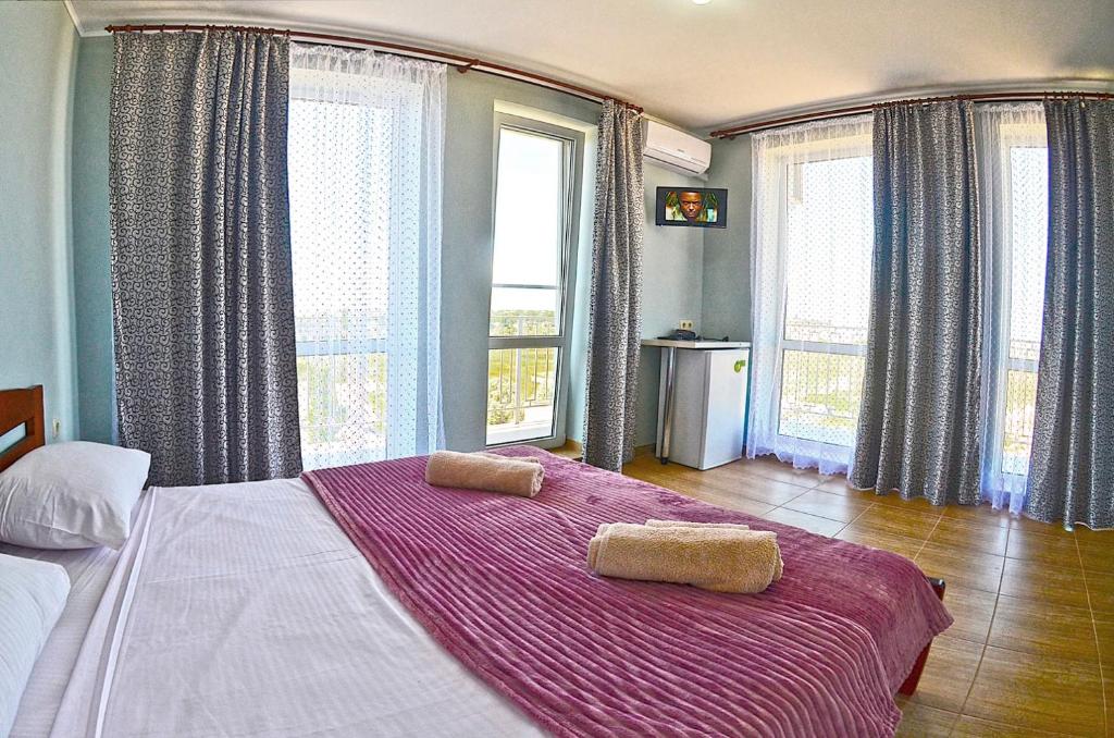 Postel nebo postele na pokoji v ubytování Hotel Golden Beach