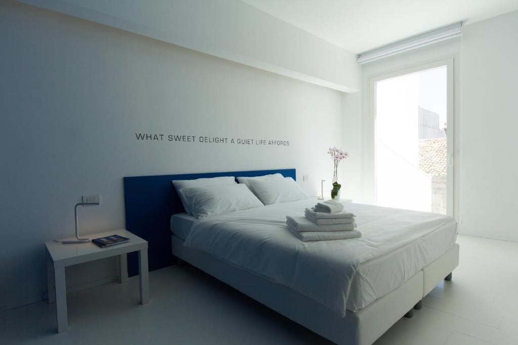 Posteľ alebo postele v izbe v ubytovaní Bed 'n Design