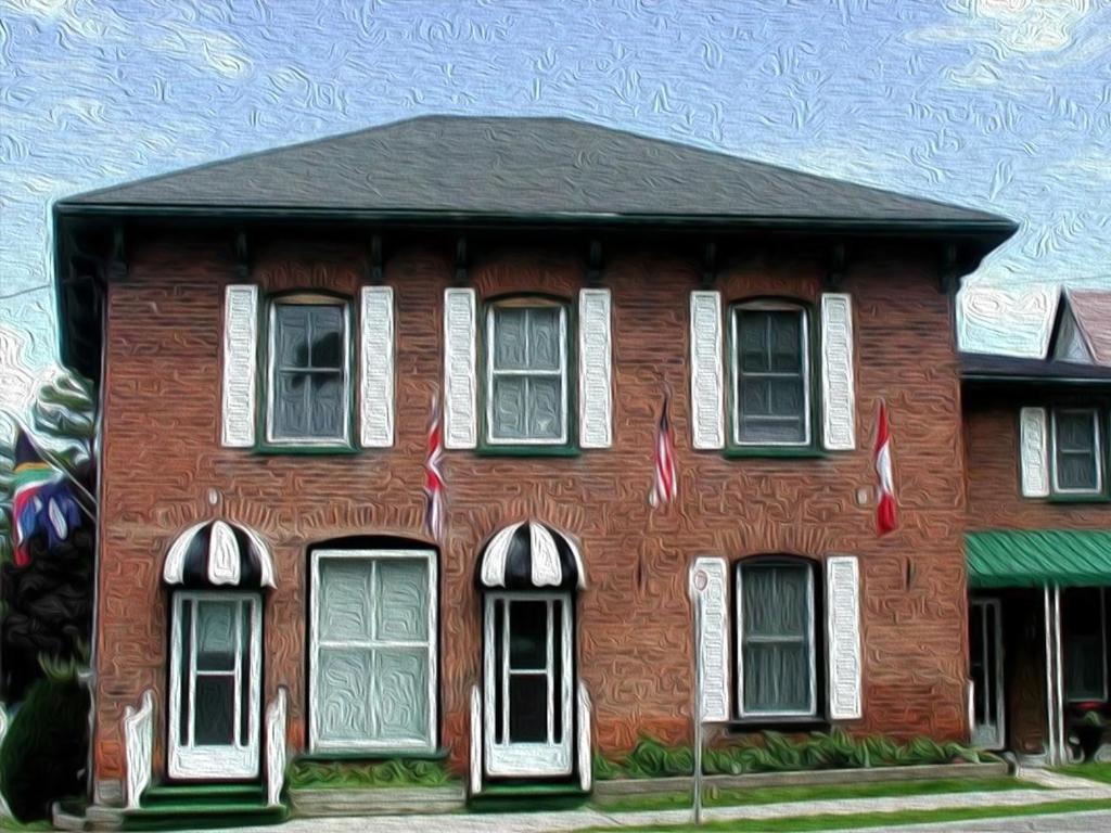 une peinture d'une maison en briques rouges avec des fenêtres blanches dans l'établissement Harrington House Picton, à Picton