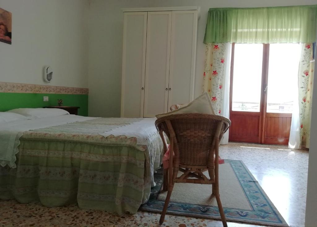 Postel nebo postele na pokoji v ubytování Albergo La Torre