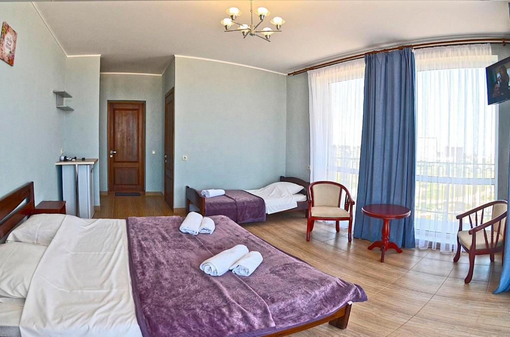 Postel nebo postele na pokoji v ubytování Hotel Golden Beach