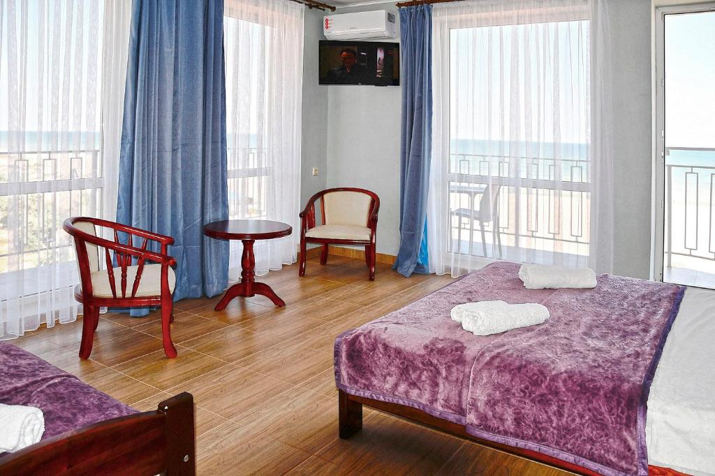Postel nebo postele na pokoji v ubytování Hotel Golden Beach