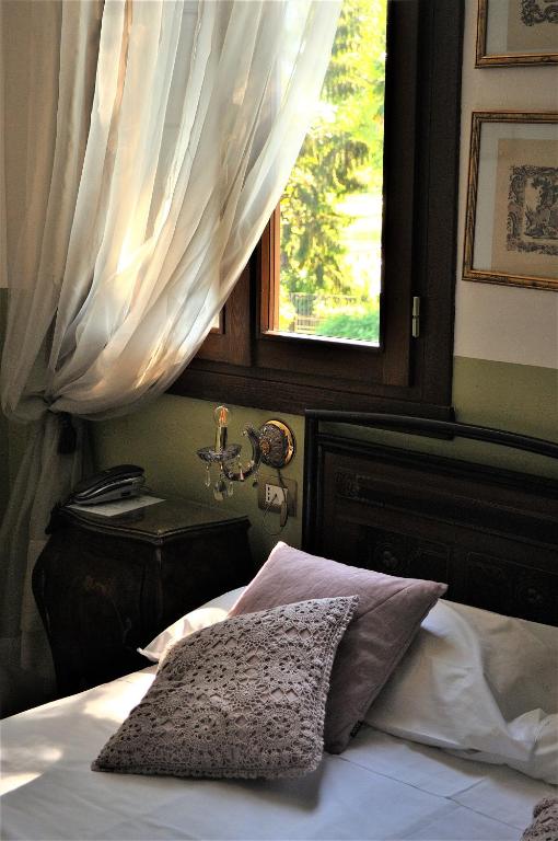 Postel nebo postele na pokoji v ubytování Relais Alcova del Doge
