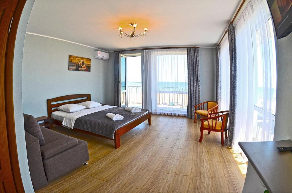 Postel nebo postele na pokoji v ubytování Hotel Golden Beach
