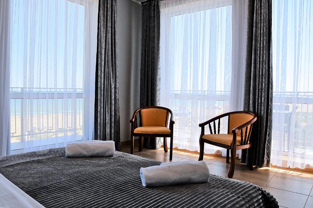 Postel nebo postele na pokoji v ubytování Hotel Golden Beach