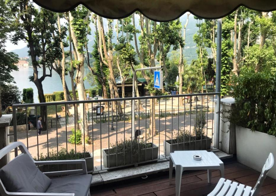 a balcony with a view of a park at HLL Hotel Lungolago Lecco in Lecco