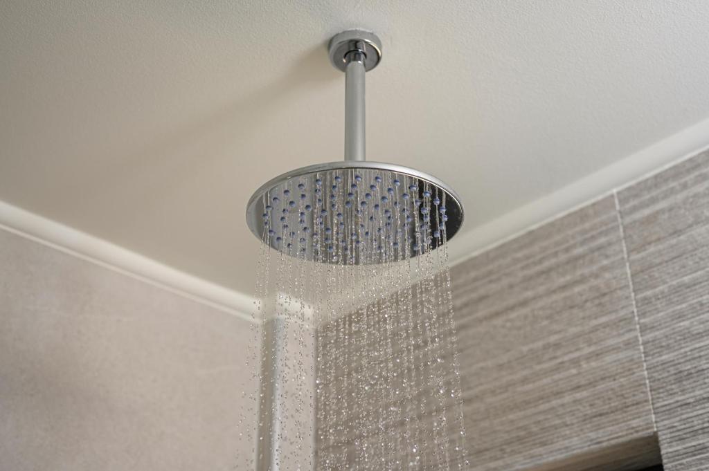 a shower with crystals on the ceiling at Athina Suites Luxury Suites Near The Sea Platanias in Platanias
