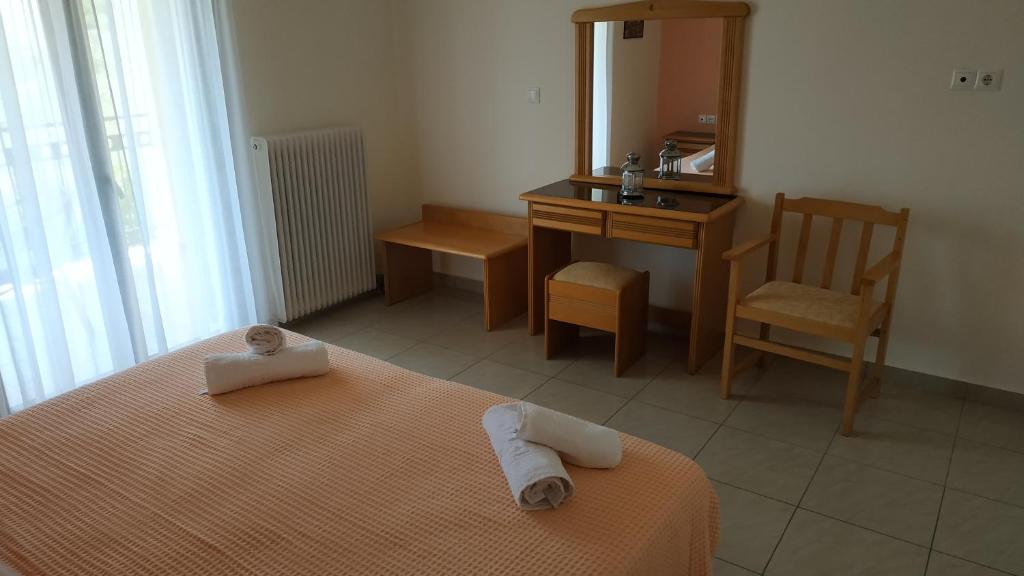 Postel nebo postele na pokoji v ubytování Hotel Patelis