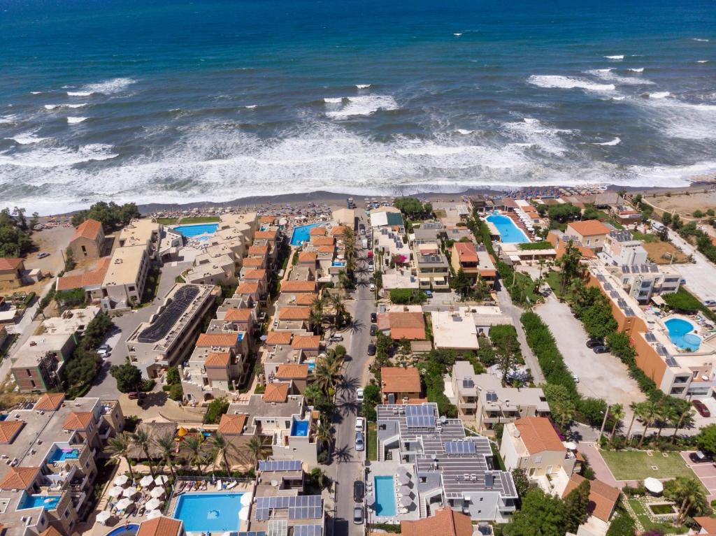 an aerial view of a resort near the ocean at Athina Suites Luxury Suites Near The Sea Platanias in Platanias