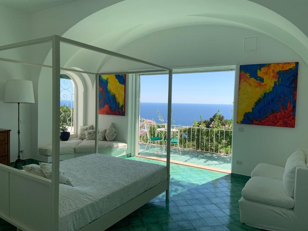 Postel nebo postele na pokoji v ubytování Il Carrubo Capri