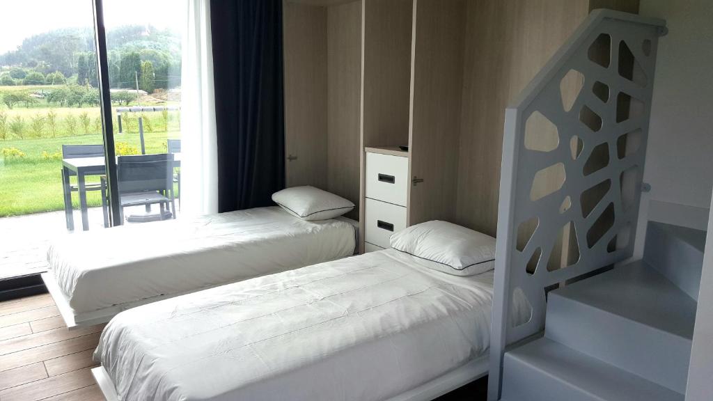 Postel nebo postele na pokoji v ubytování APARTAMENTOS VALLE DE IROLA