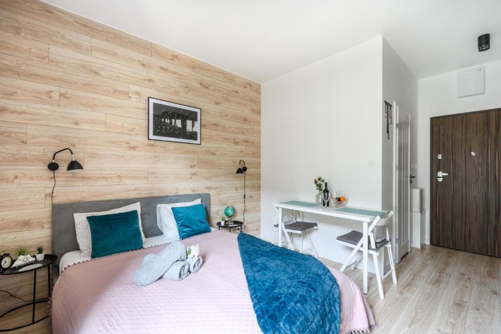 Posteľ alebo postele v izbe v ubytovaní Aparthotel Pawia Deluxe