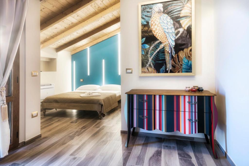 Postel nebo postele na pokoji v ubytování Palazzo Eugenia Suites