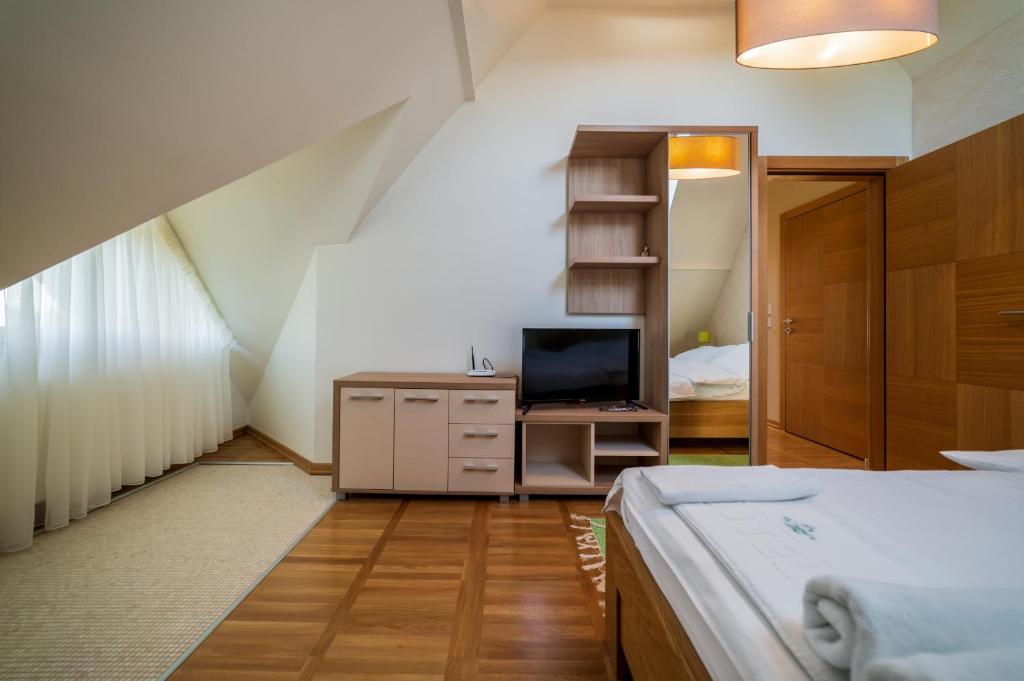 Postel nebo postele na pokoji v ubytování Vila Valentina