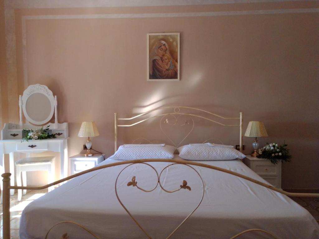 Postel nebo postele na pokoji v ubytování B&B La Felicità