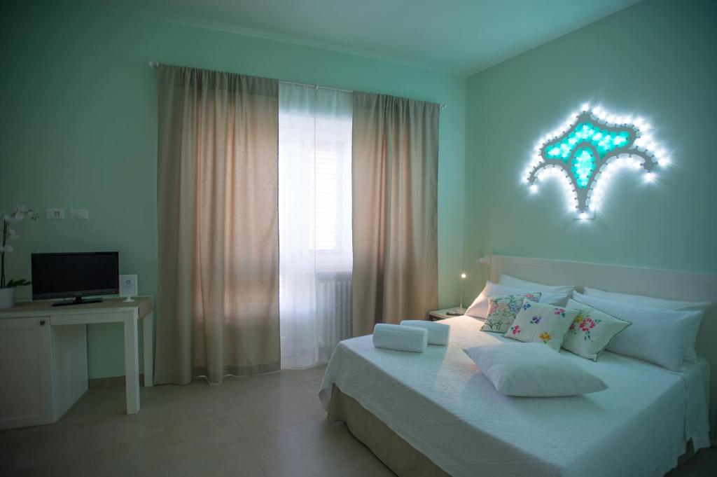 Posteľ alebo postele v izbe v ubytovaní Luci del Salento Guest House