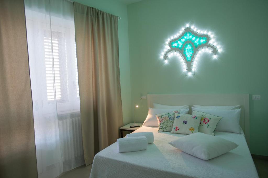 Posteľ alebo postele v izbe v ubytovaní Luci del Salento Guest House