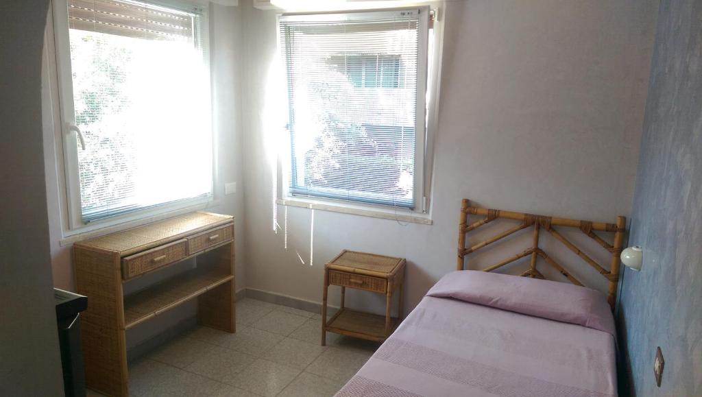 Postel nebo postele na pokoji v ubytování Albergo Villa Anna