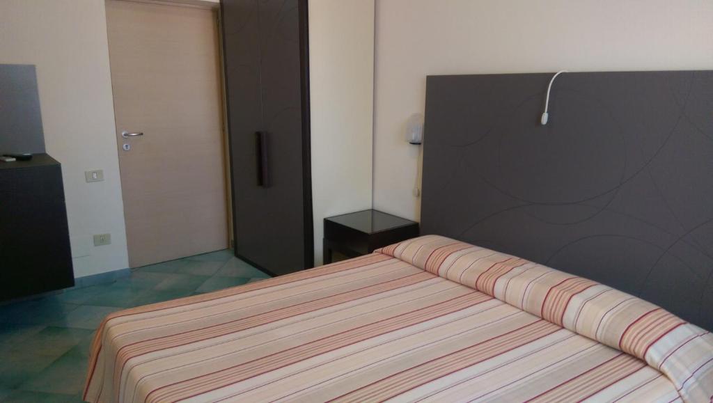 Postel nebo postele na pokoji v ubytování Albergo Villa Anna