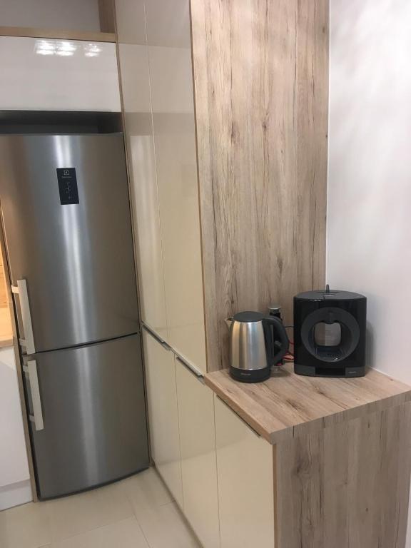 Kuchyň nebo kuchyňský kout v ubytování SUN-DIAL APARTMAN