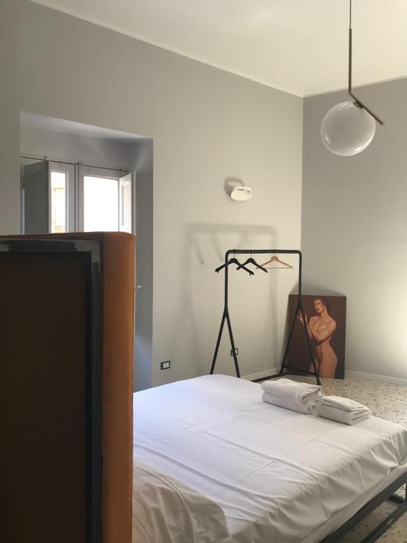 Łóżko lub łóżka w pokoju w obiekcie Dimora San Camillo