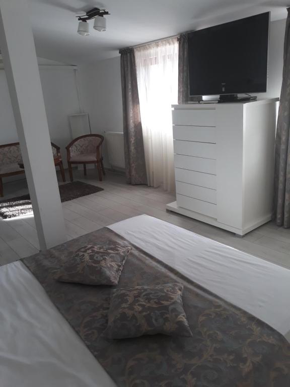 Postel nebo postele na pokoji v ubytování Hotel Royal