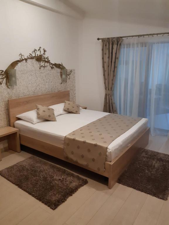 Postel nebo postele na pokoji v ubytování Hotel Royal
