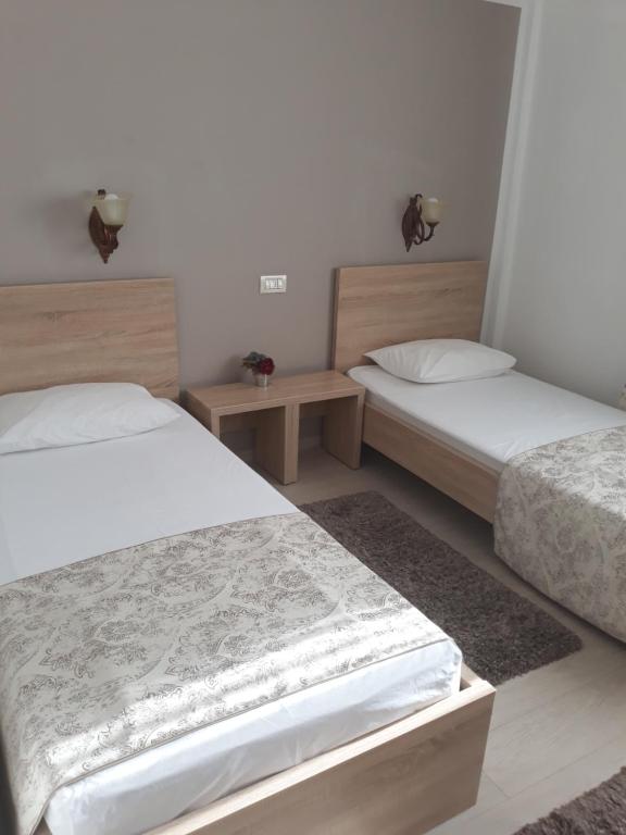 Postel nebo postele na pokoji v ubytování Hotel Royal