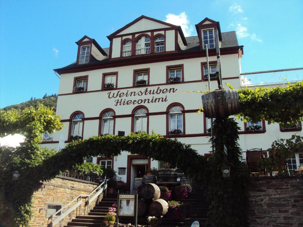 a building with a sign for a winery at Hotel Hieronimi in Cochem