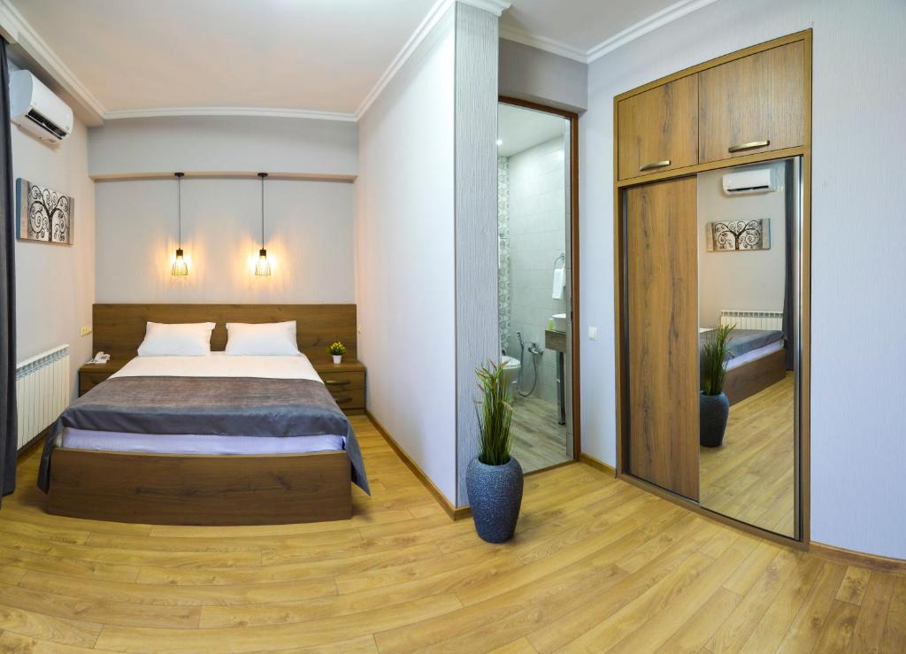 Postel nebo postele na pokoji v ubytování Hotel Livin