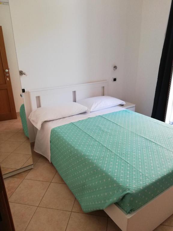 Posteľ alebo postele v izbe v ubytovaní DOMO ALGHERO CENTRO
