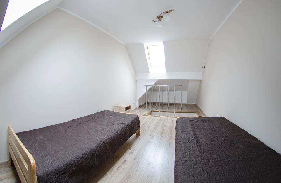 Posteľ alebo postele v izbe v ubytovaní Apartamenty Giżycko