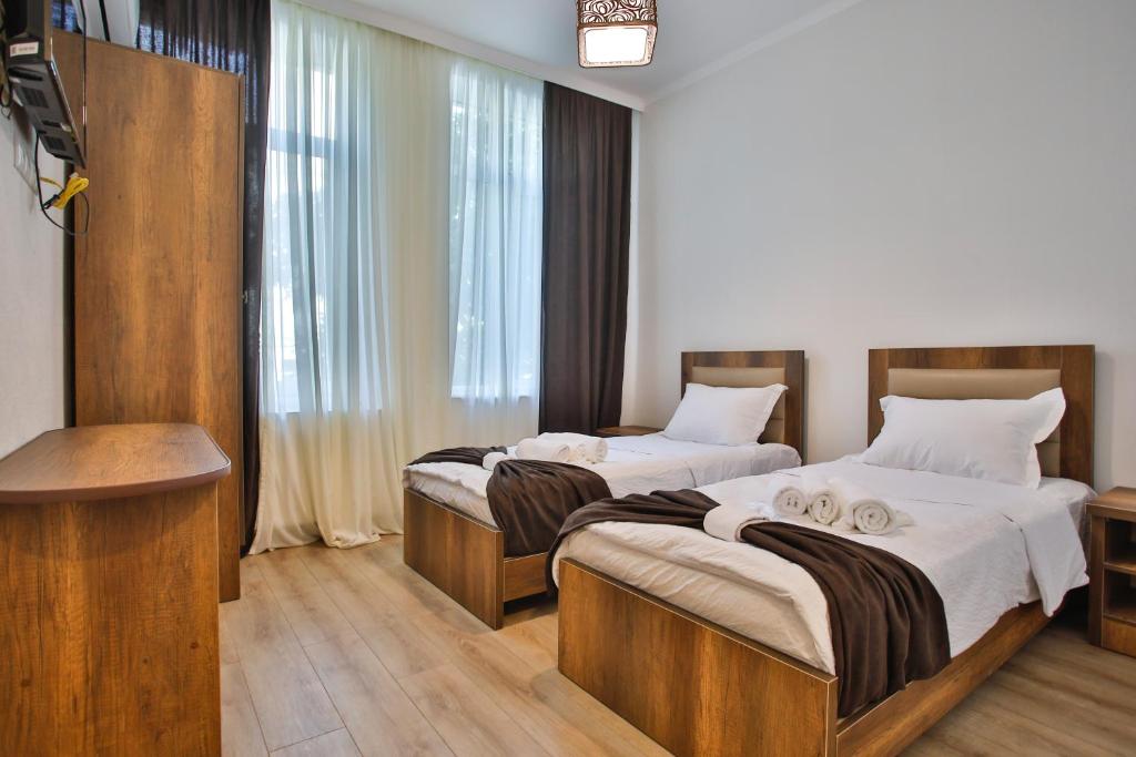 Postel nebo postele na pokoji v ubytování Chveni Qalaqi