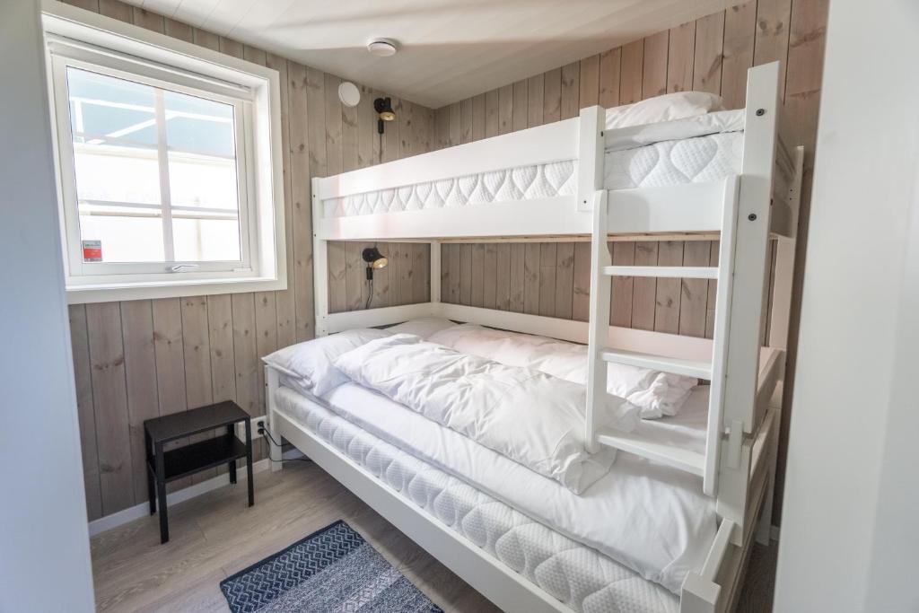 Dviaukštė lova arba lovos apgyvendinimo įstaigoje Madelhea Cabin- Seaview Lodge