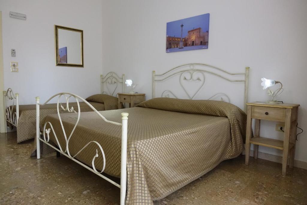 Postel nebo postele na pokoji v ubytování Don Nicola Residence