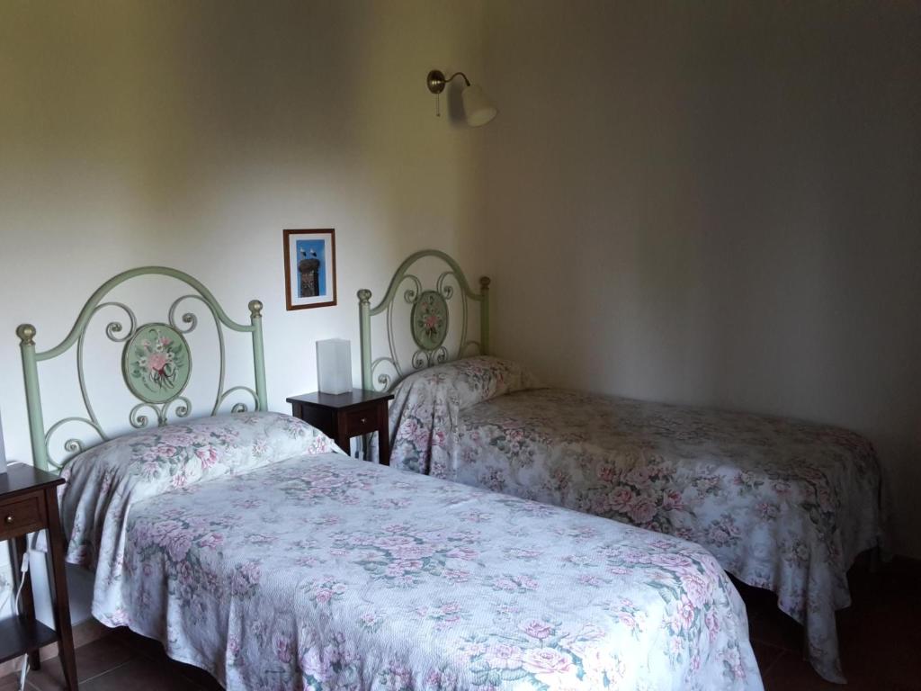 Łóżko lub łóżka w pokoju w obiekcie Fattoria Casanova
