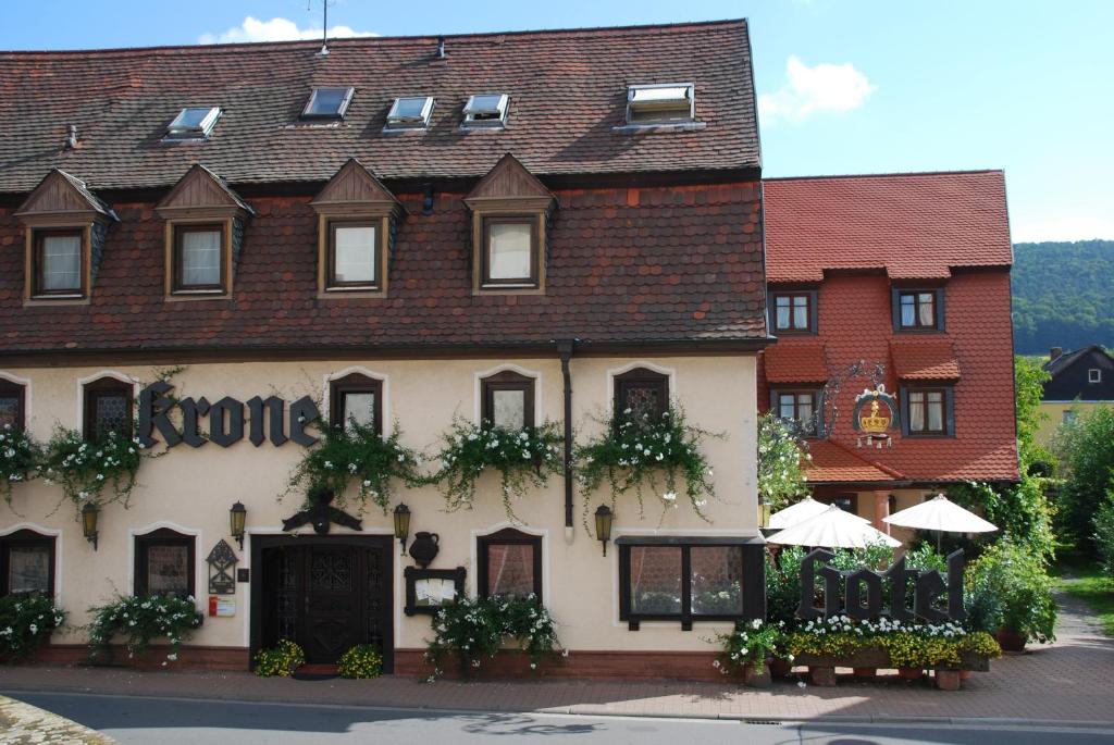 a building with a sign on the front of it at Hotel Krone in Laudenbach