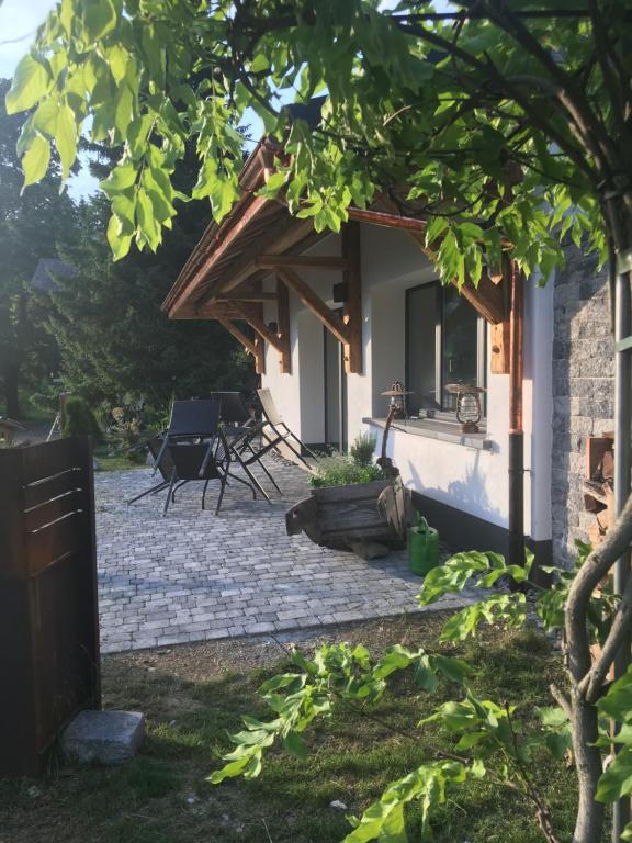 a patio in front of a house at Chalet L'Escapade in Charmey