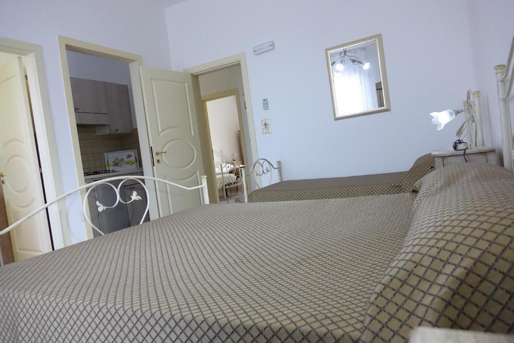 Postel nebo postele na pokoji v ubytování Don Nicola Residence