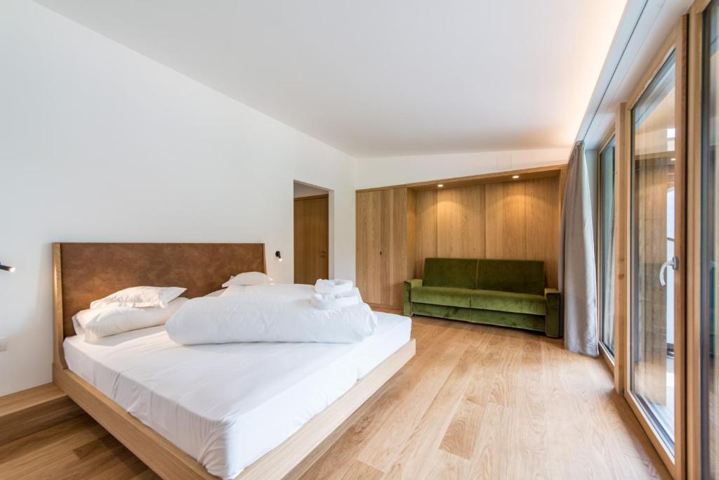 Postel nebo postele na pokoji v ubytování Hotel Taufers